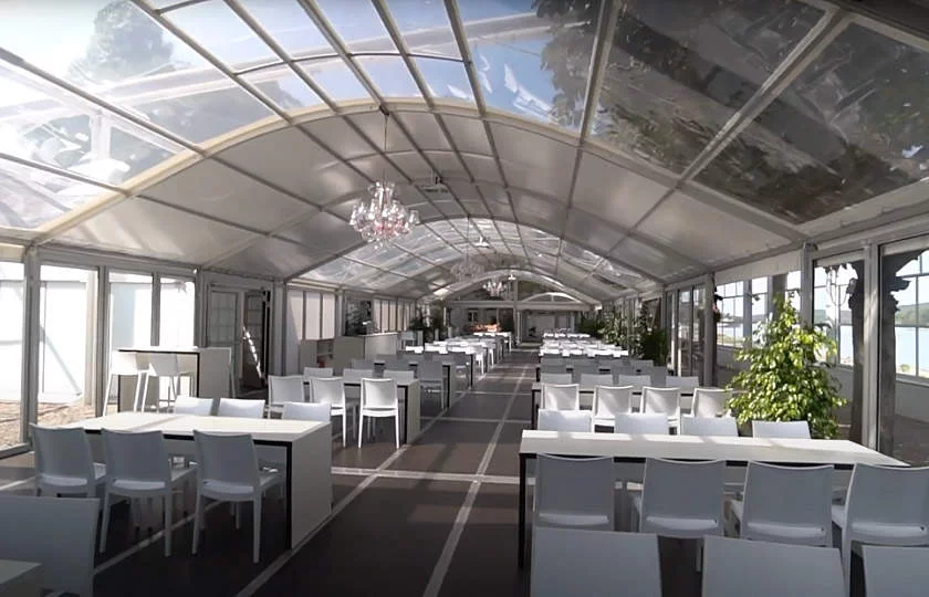 A bodega tent with a covered banquet for a wedding